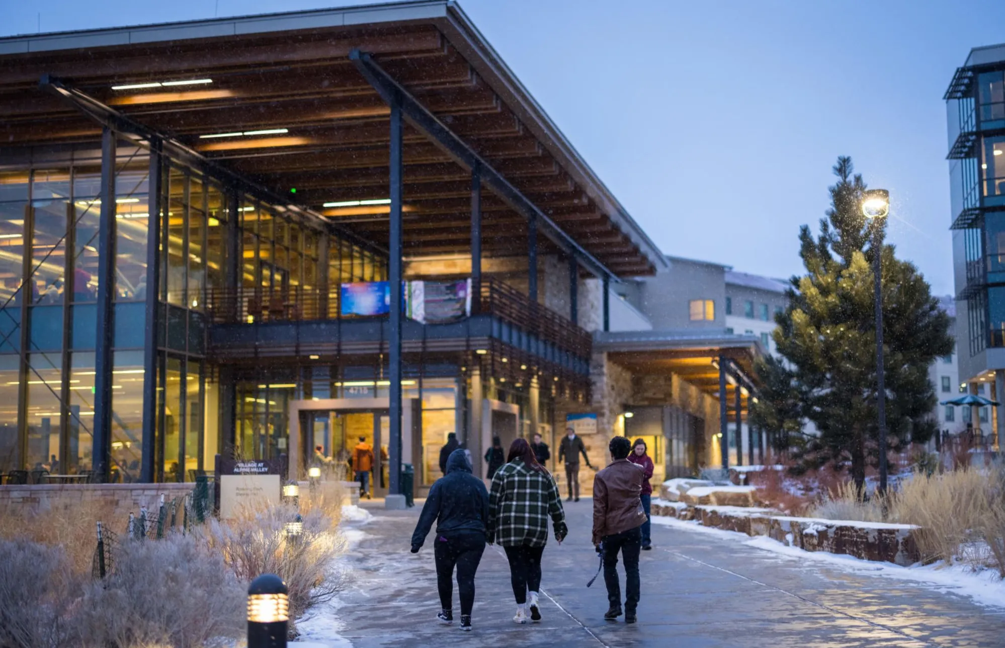students outside a uccs building during winter