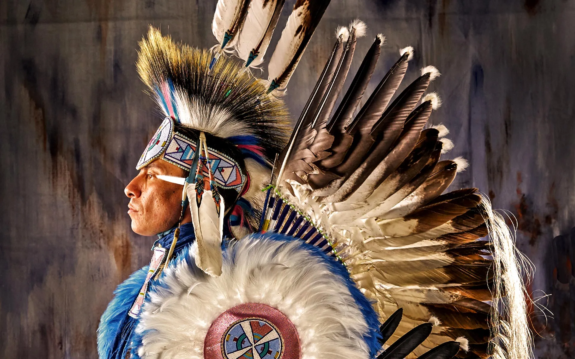 A Native American person dressed in traditional clothes 